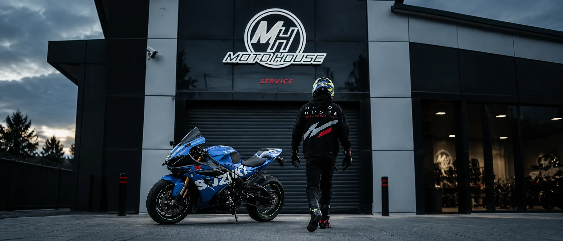 team: mechanics and riders outside the store